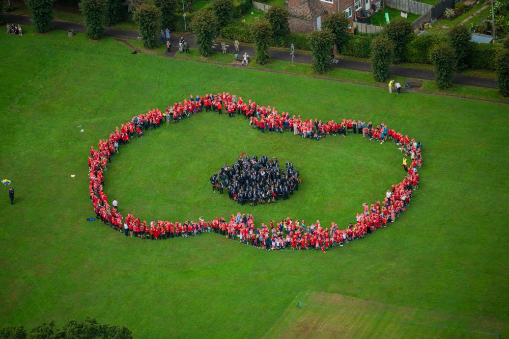 Photos of elements from 1 Regt AAC flew over to Wincanton to capture children from the local schools shapped into the figure of a Poppy. Captured 2023/09/12