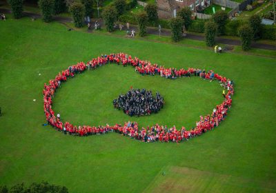 Photos of elements from 1 Regt AAC flew over to Wincanton to capture children from the local schools shapped into the figure of a Poppy. Captured 2023/09/12