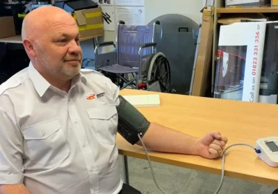 Alec Billen, courier manager at Berry's Coaches, has his blood pressure checked. Picture: Somerset Council