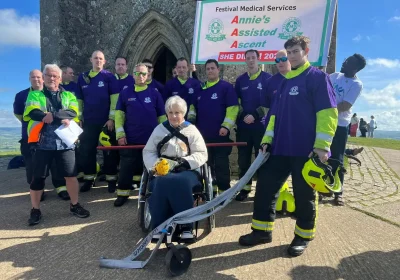 Annie atop Glastonbury Tor with firefighters and FMS supporters