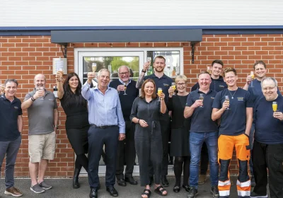 Atlantas Marine team members celebrating outside the company’s Yeovil offices. Picture: Scott Macintyre Photography