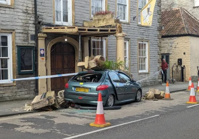 The car crashed into a concrete porch outside the Langport Arms Hotel on Saturday night. Pictures: Somerset Leveller