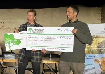 Rita and Adam picking up their award at a ceremony in Hampshire