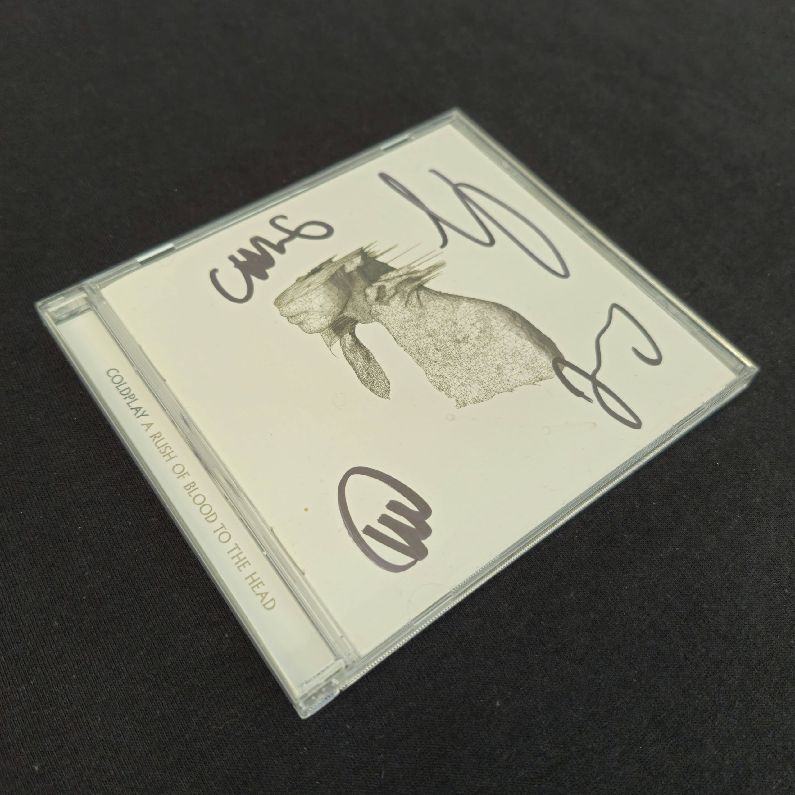 Signed A Rush of Blood to the Head album Picture: Rave From The Grave