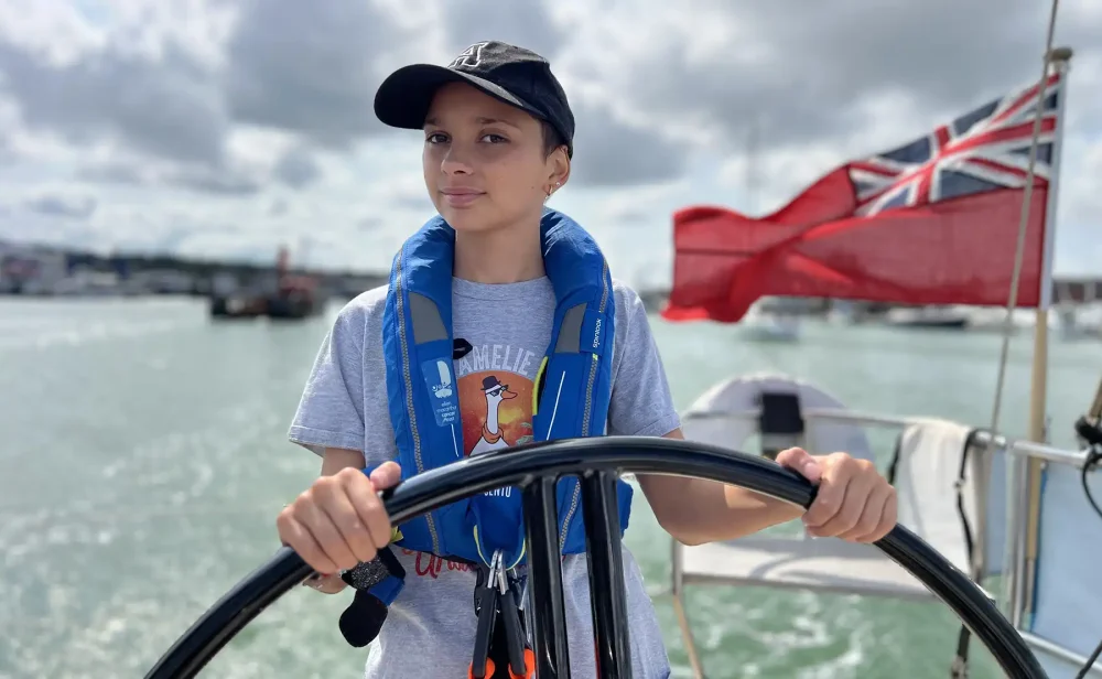 In control: Amelie at the wheel. Picture: Ellen MacArthur Cancer Trust