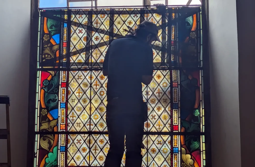 The window is being restored after enduring heavy winter weather