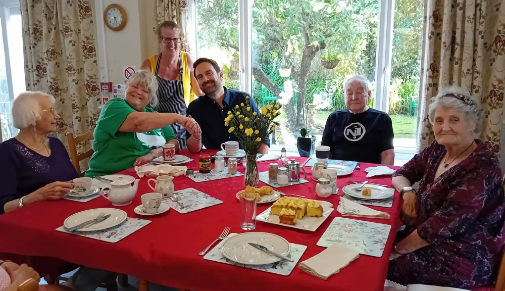 Dan Aldridge with residents and staff during his visit to Abbeyfield House