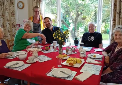 Dan Aldridge with residents and staff during his visit to Abbeyfield House