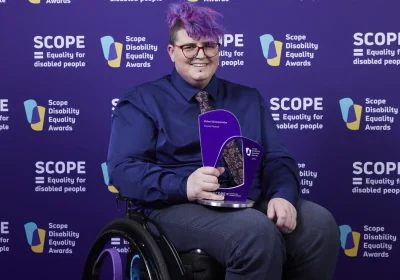 NHS trainee clinical coder Zahari Brimacombe with their award