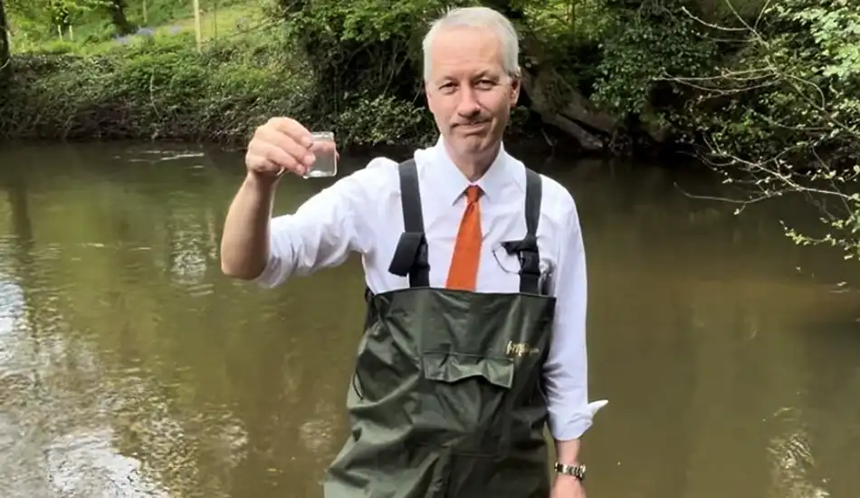 Taunton & Wellington MP Gideon Amos in the River Tone
