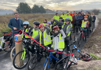 Cllr Wilkins opens the new route alongside Bridgwater school children and other representatives. Picture: Somerset Council