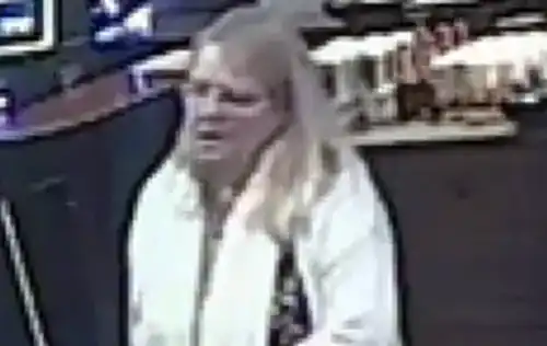 Officers are keen to trace this woman, pictured at the Perkin Warbeck in Taunton. Picture: Avon & Somerset Police