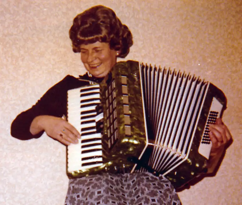 Erna has always been musical, and plays her harmonica to this day