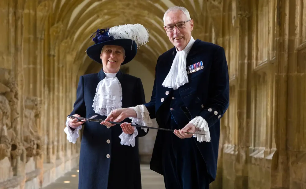 Rob Buckley handing over the sword of the office to Janet Montgomery
