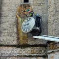 The clock face being taken down in Montacute