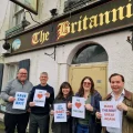 Members of the East Wells Community Benefit Society steering group showing support for The Britannia Inn, Wells