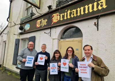 Members of the East Wells Community Benefit Society steering group showing support for The Britannia Inn, Wells