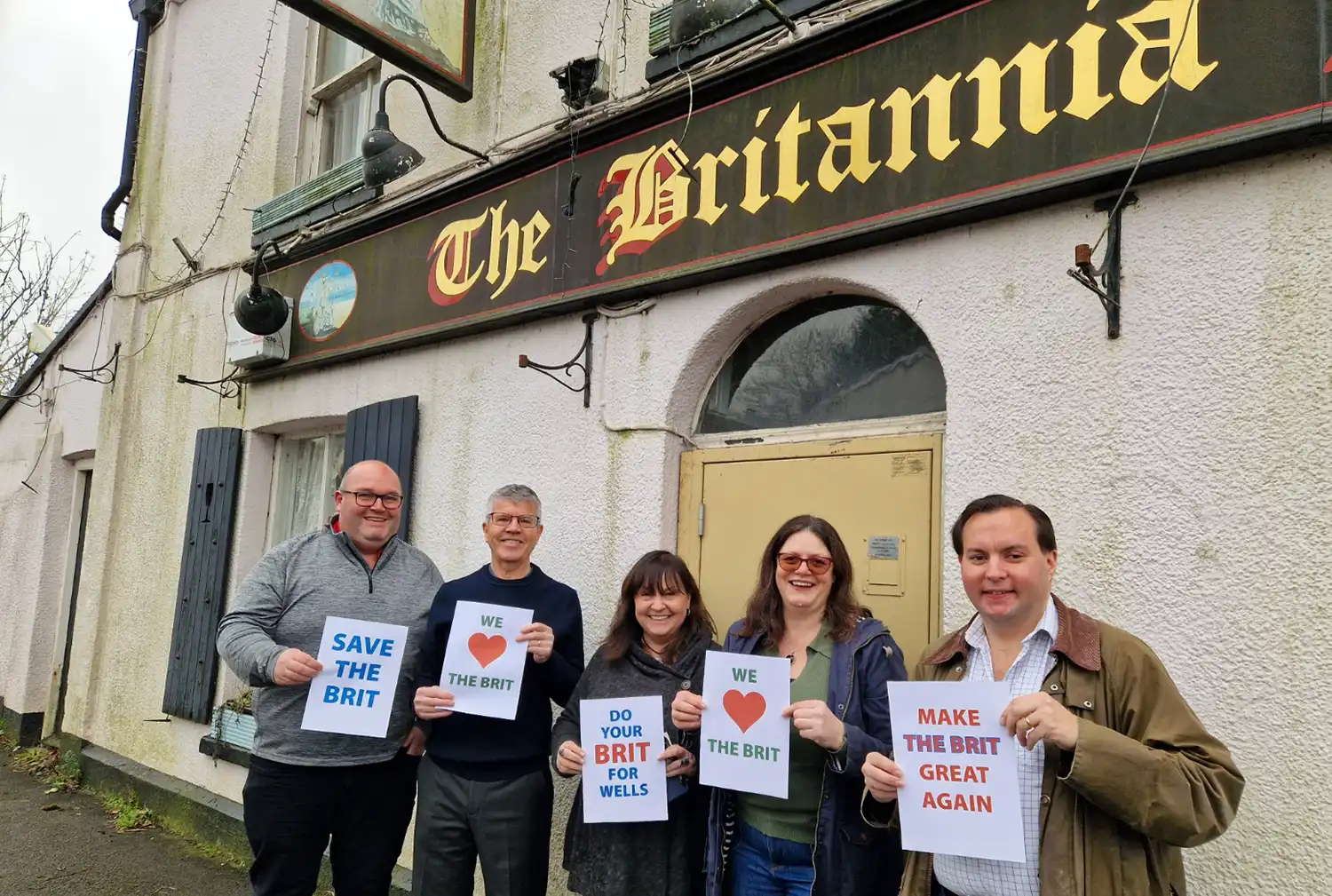 Members of the East Wells Community Benefit Society steering group showing support for The Britannia Inn, Wells