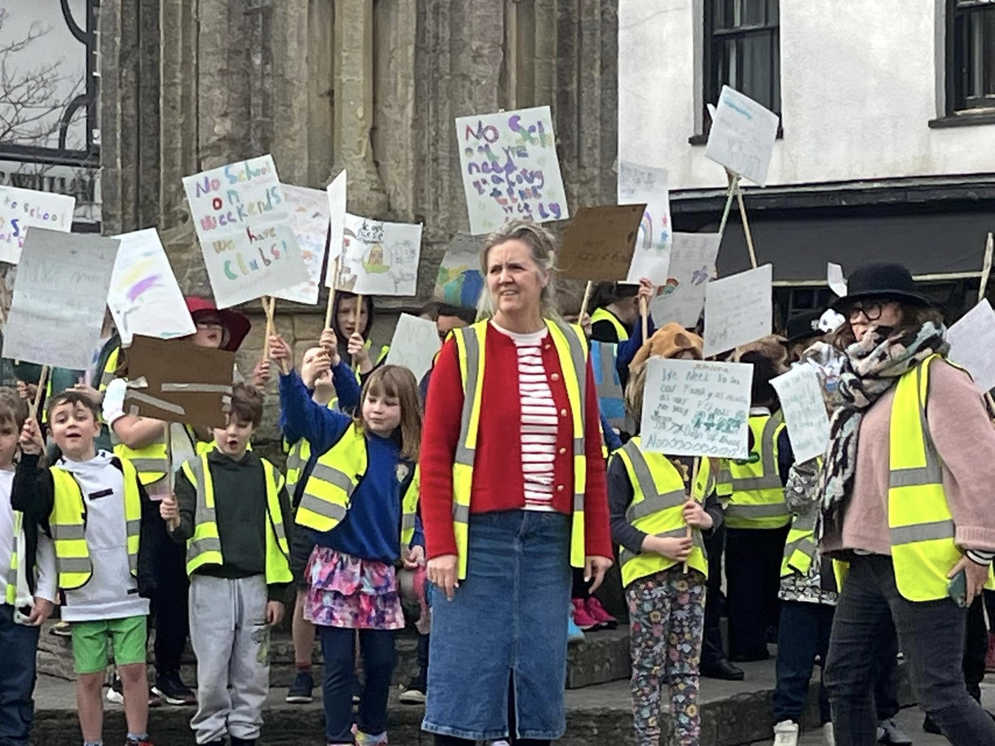 Mrs Devine with the pupils The children were cheered on by passersby Picture: Glastonbury Town Council/St John's