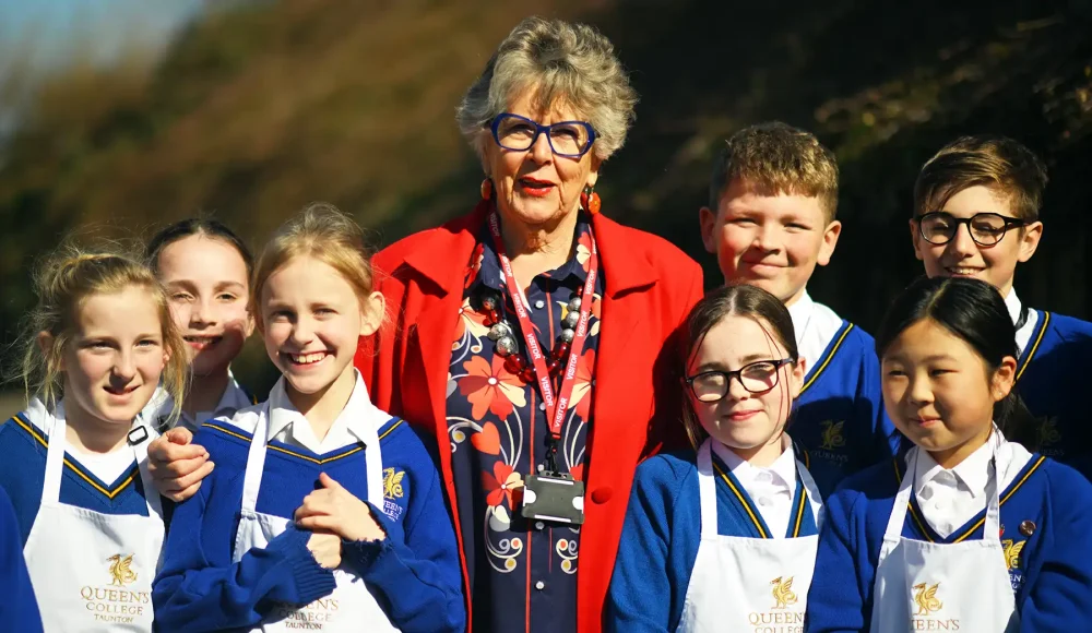 Dame Prue Leith DBE with Queen's College pupils