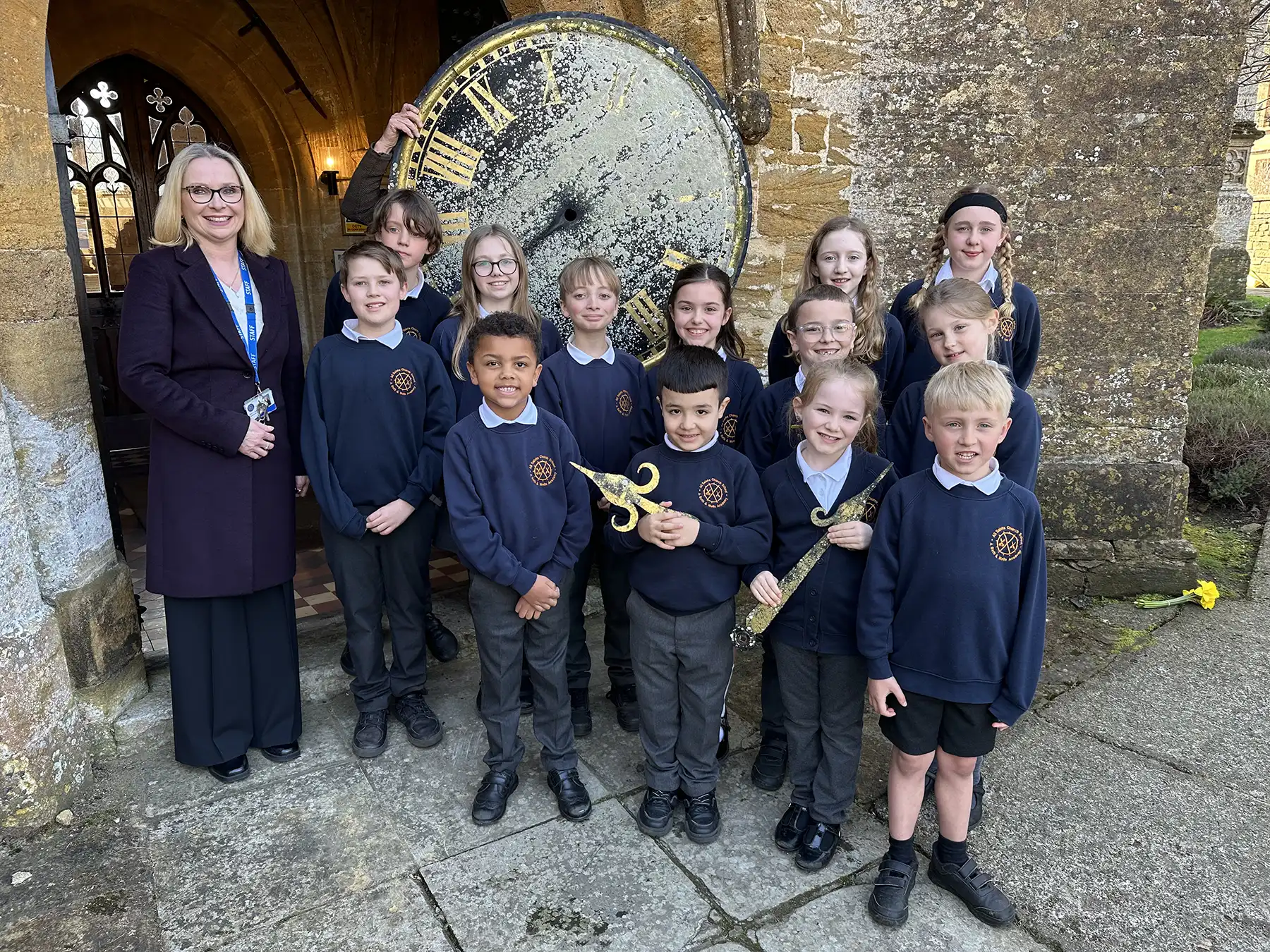 School council members from All Saints Church School with the clock face