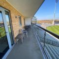 The apartment boasts a private balcony with views of the County Ground in Taunton