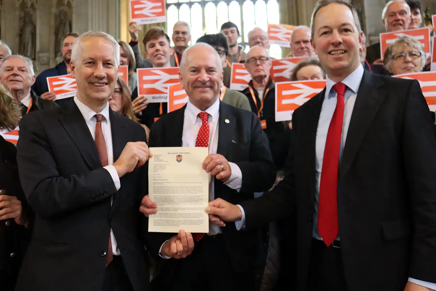 Gideon Amos, Lord Hendy and Richard Foord with the letter from Wellington Town Council