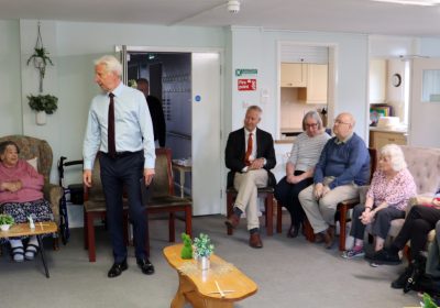 Paul Tennant updating Ivy House residents in Wellington