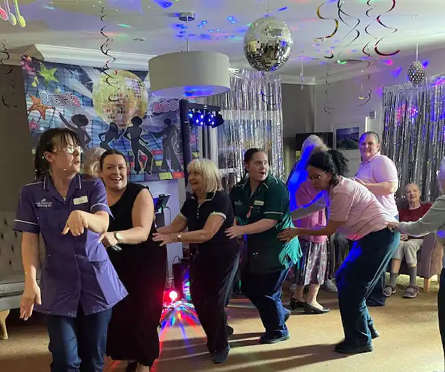Staff get the disco started at the Wells Dementia Disco