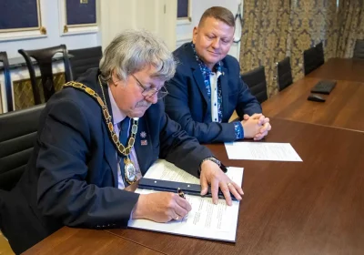 Chair of Somerset Council, Mike Best, signing the Memorandum of Understanding as Ukrainian Ambassador to the UK, Valerii Zaluzhnyi, looks on. Picture: Somerset Council