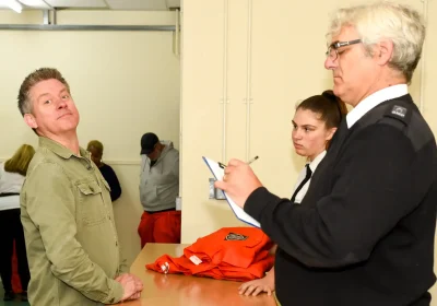 Richard McCourt - of Dick and Dom fame - fails to amuse the guards as he is booked in at Shepton Mallet Prison... Picture: Jon Gilbert Photography