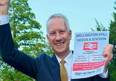 Taunton & Wellington MP Gideon Amos celebrates the station news