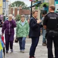 MP Sarah Dyke with police in Glastonbury High Street