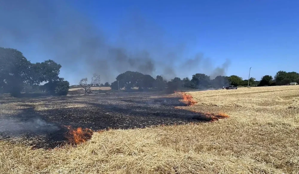 Fire crews battled to control the blaze, in a field at Ashill, near Ilminster. Picture: Chard Fire Station