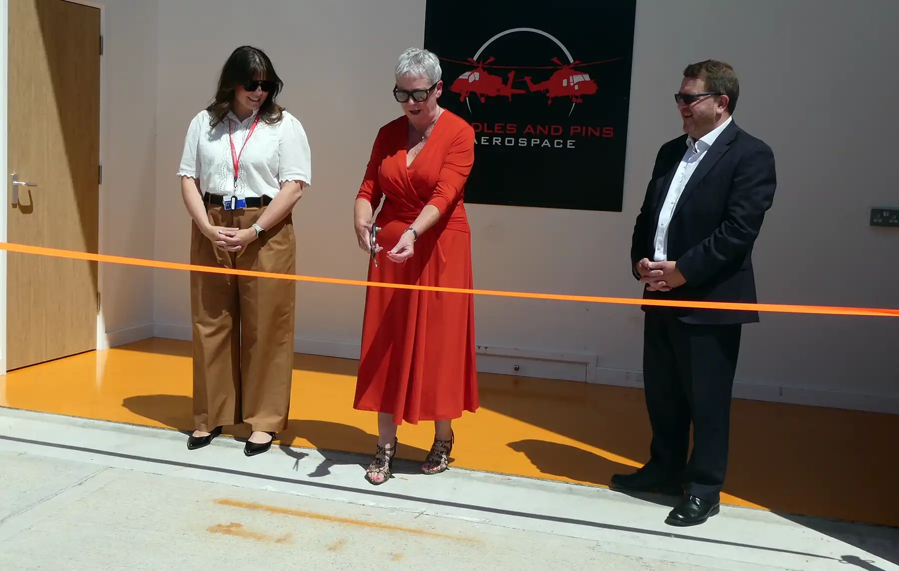 Carole Champion cuts the ribbon at the new facilities in Somerton