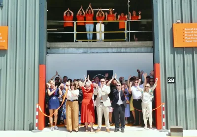 Staff and visitors at the celebration of the Needles and Pins Aerospace expansion
