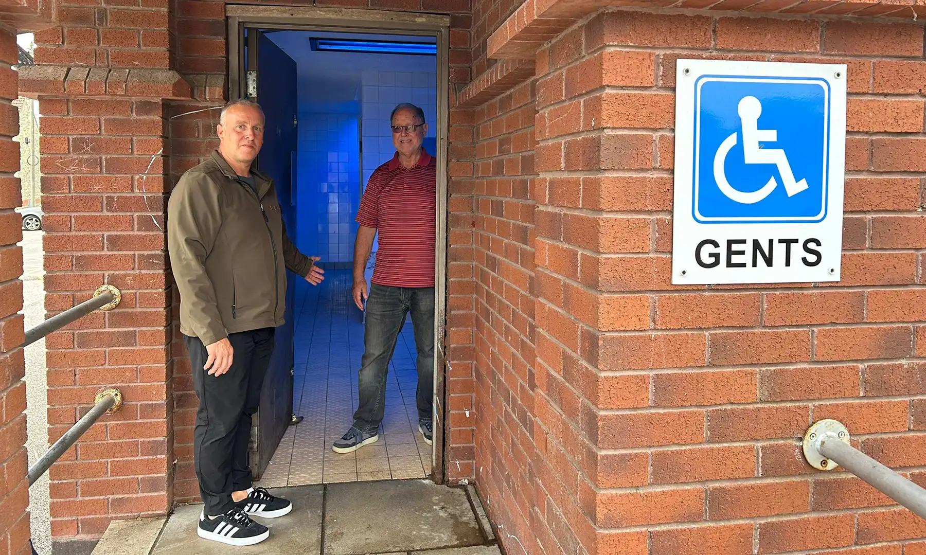 Cllr Jason Baker and Cllr Andy Kenton at the re-opened toilet block in Chard