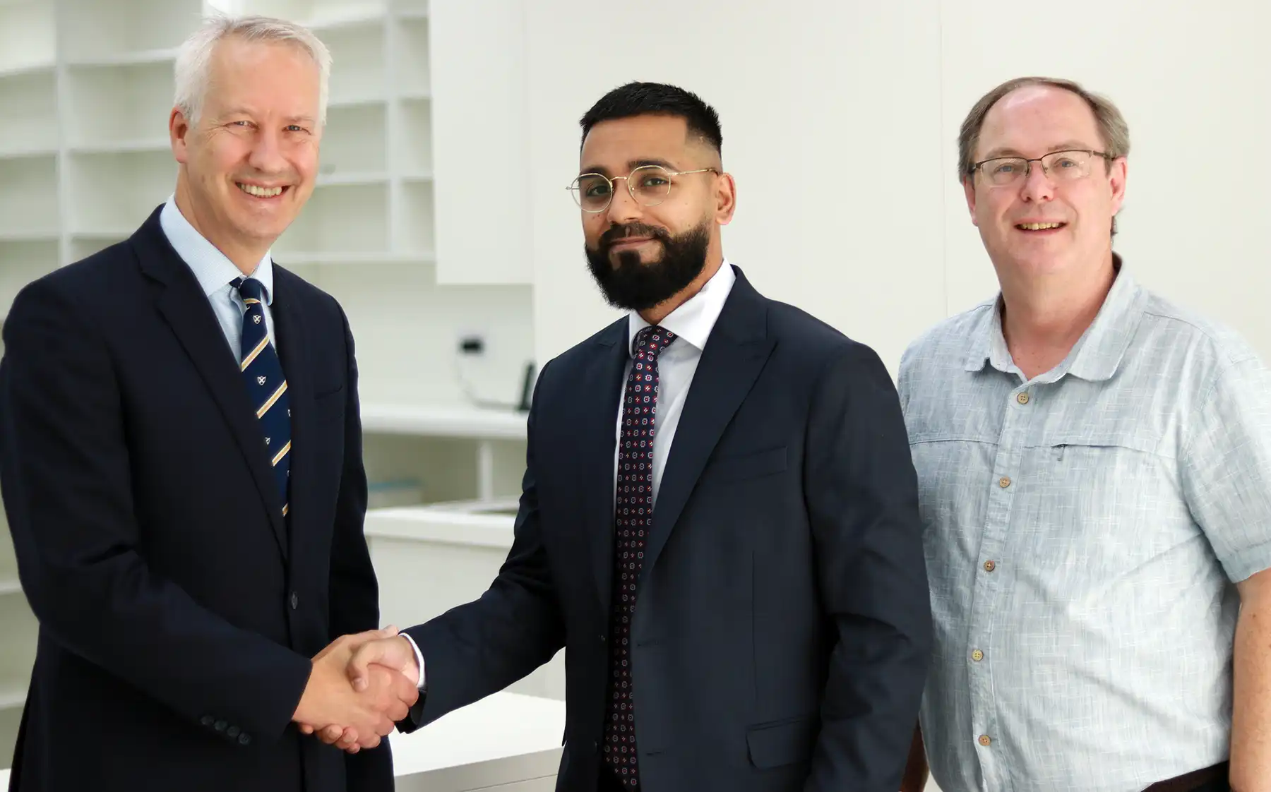 Taunton MP Gideon Amos with pharmacist Mo Idris and Cllr Andy Sully