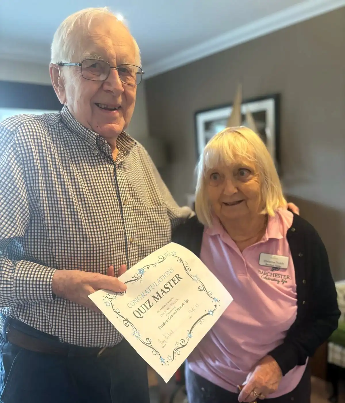 Crandon Springs resident quiz master Tony with winner Christine