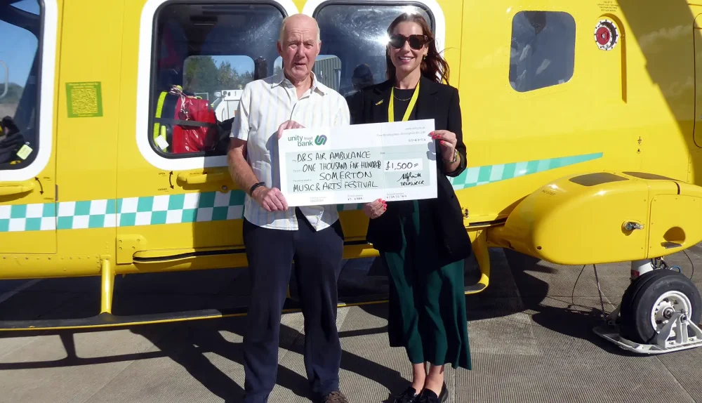 Charlotte Humber, of Dorset & Somerset Air Ambulance, receives a cheque from Martyn Smith, treasurer of Somerton Music & Arts Festival