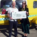 Charlotte Humber, of Dorset & Somerset Air Ambulance, receives a cheque from Martyn Smith, treasurer of Somerton Music & Arts Festival