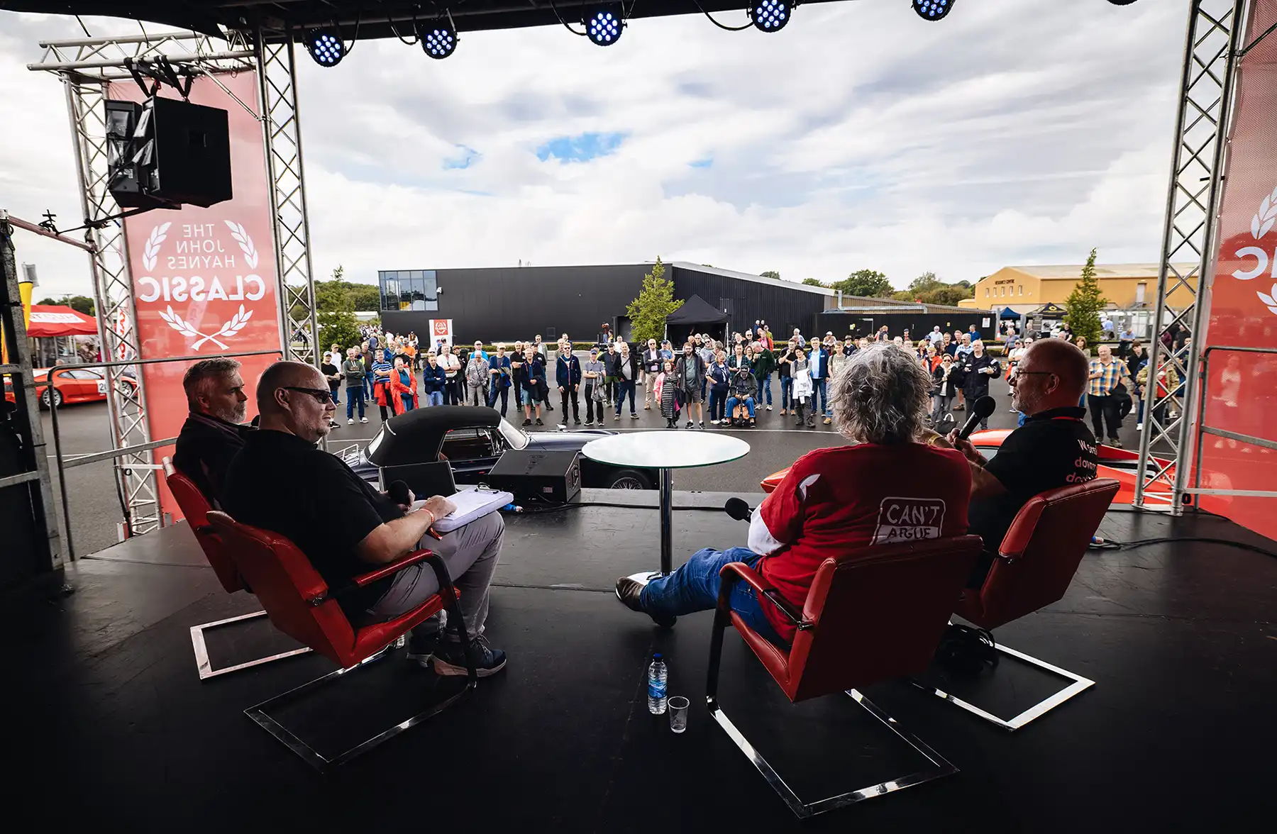 Speakers on the stage at the John Haynes Classic Car Rally at the Sparkford museum