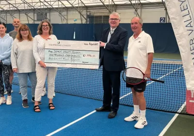 George Persson, trustee of The Ralph and Irma Sperring Charity, with Jenny Perez (Chair), Jenny Barton (Co-ordinator), Martin Carruthers (Treasurer), and attendees of the Rusty Racketeers Club