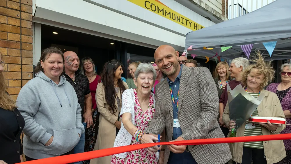 Alliance Homes chief operating officer, Iain Lock, cuts the ribbon at the Coronation Community Hub in Weston with resident, Jayne Williams