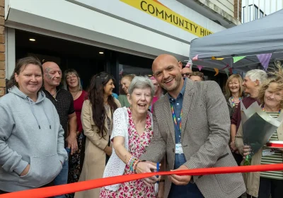 Alliance Homes chief operating officer, Iain Lock, cuts the ribbon at the Coronation Community Hub in Weston with resident, Jayne Williams