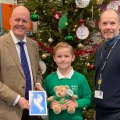 Bridgwater MP Sir Ashley Fox with last year's Christmas card competition winner Owen, of Somerset Bridge Primary School