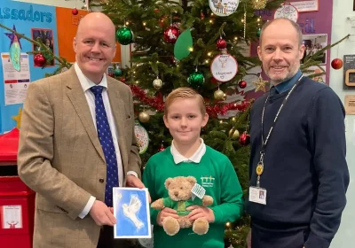 Bridgwater MP Sir Ashley Fox with last year's Christmas card competition winner Owen, of Somerset Bridge Primary School