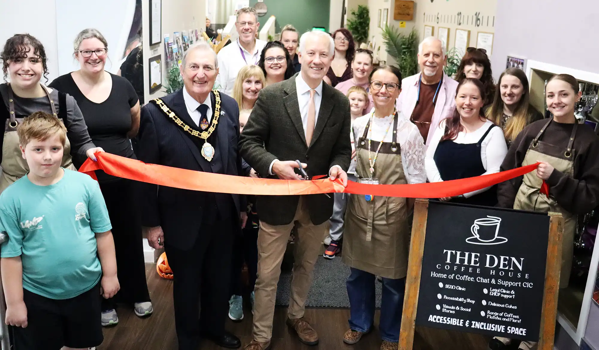 MP Gideon Amos cuts the ribbon at The Den, in Paul Street, Taunton