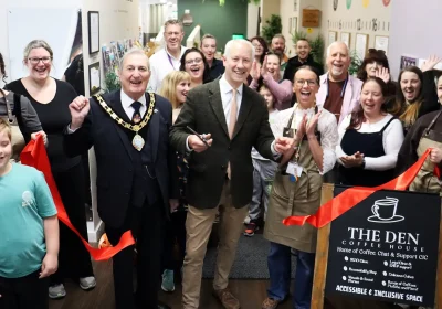 MP Gideon Amos cuts the ribbon at The Den, in Paul Street, Taunton