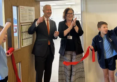 MP Gideon Amos cuts the ribbon to officially open the news kitchens